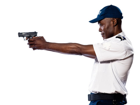 Male police officer aiming gun