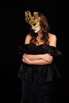 woman in golden party mask