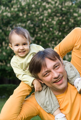 smiling dad and baby