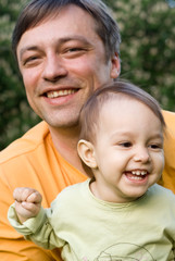 smiling dad and baby