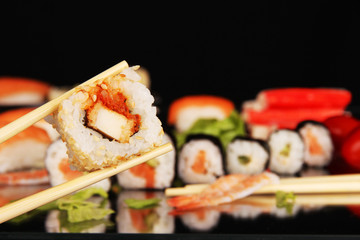 Delicious sushi on  black background