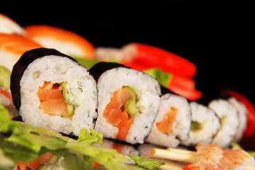 Delicious sushi on  black background