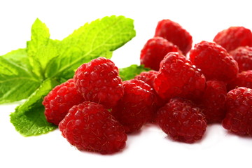 Ripe raspberries on a white background.