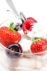 ice cream, cherries, raspberries, strawberries and spoon isolate
