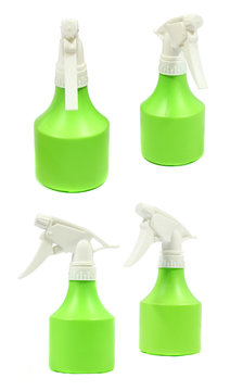 green plastic water spray bottle isolated on white background