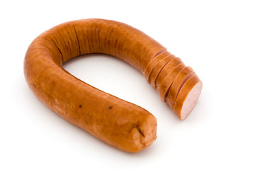 Sliced smoked sausage over white