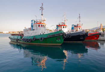 Fototapeta premium Three tugboats in harbour.