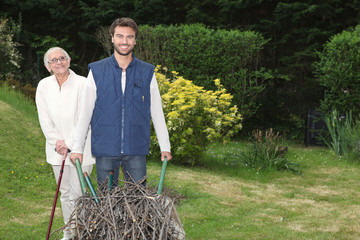 Son pushing wheel-barrow