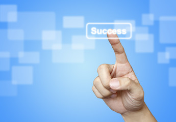 The hand press Success button on blue background