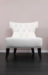 One white leather comfortable armchair