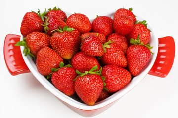 Ripe fresh strawberry in bowl form the heart