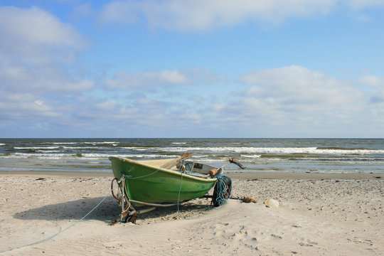traditional fishing boats hauled at shore on the beach