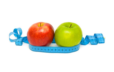 apples and measuring tape on white background