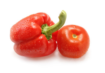 Tomato and pepper on white background