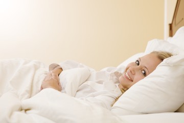 Peaceful Woman Lying in Bed Resting at Home