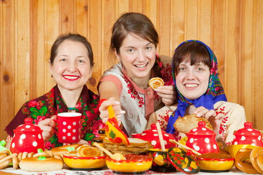 Women  eats pancake with caviare