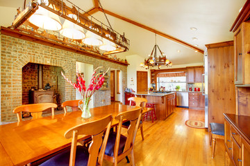 Country large kitchen and dining room with brick stove