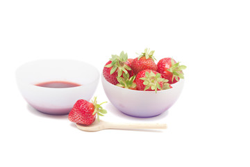 Bowl with strawberry jam isolated on white