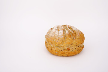 Newly baked appetizing whole meal multigrain bread on white back