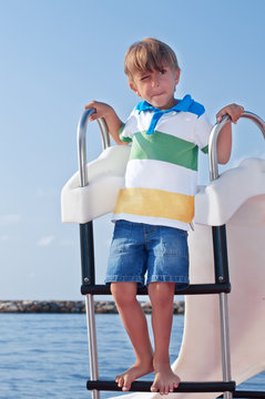 Boy on a catamaran in the Mediterranean
