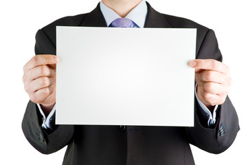 Businessman holding blank card