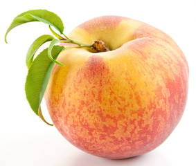Ripe peach with leaves