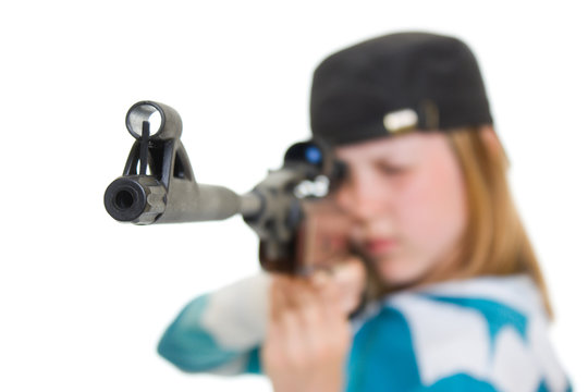 A teenager with a gun on a white background.