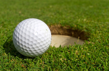 Golf ball just near the hole