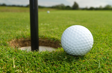 Golf ball just near the hole