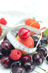 measure tape,strawberry, apricot, cherry and raspberry isolated