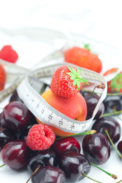 measure tape,strawberry, apricot, cherry and raspberry isolated