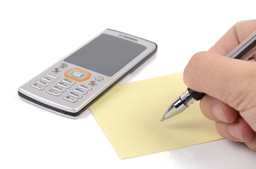 Mobile phone,pen and notepaper
