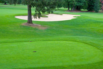 Teeing area over a sand bunker.