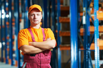 caucasian young manual worker in warehouse
