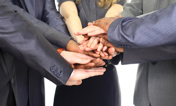 Image of business partners hands on top of each other