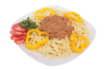 Spaghetti with meat sauce, parsley, tomatoes and peppers on a pl