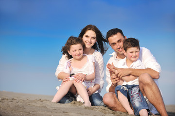 happy young family have fun on beach
