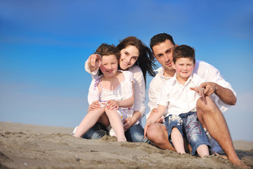 happy young family have fun on beach