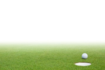 Golf ball and green grass