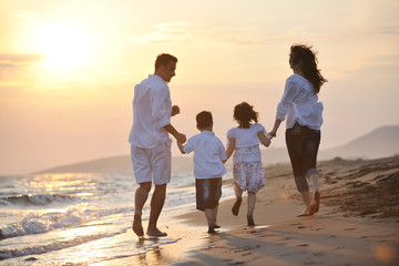 happy young family have fun on beach