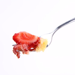 Piece of Strawberry Tart on a fork on a white background