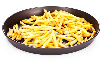 French fries in the pan isolated on white