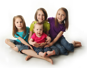 Four young adorable sisters