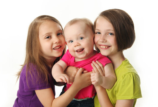 Three cute young sisters