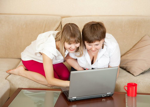 wonder women looking to laptop