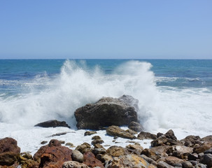 Crashing waves on a rock