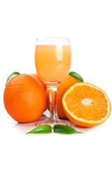 Orange juice in glass and fruits