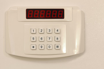 Small home or hotel wall safe with keypad, closed door