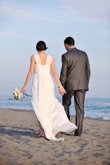 romantic beach wedding at sunset