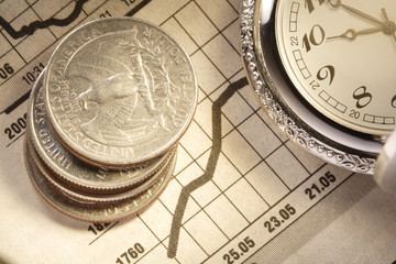 coin and clock on chart